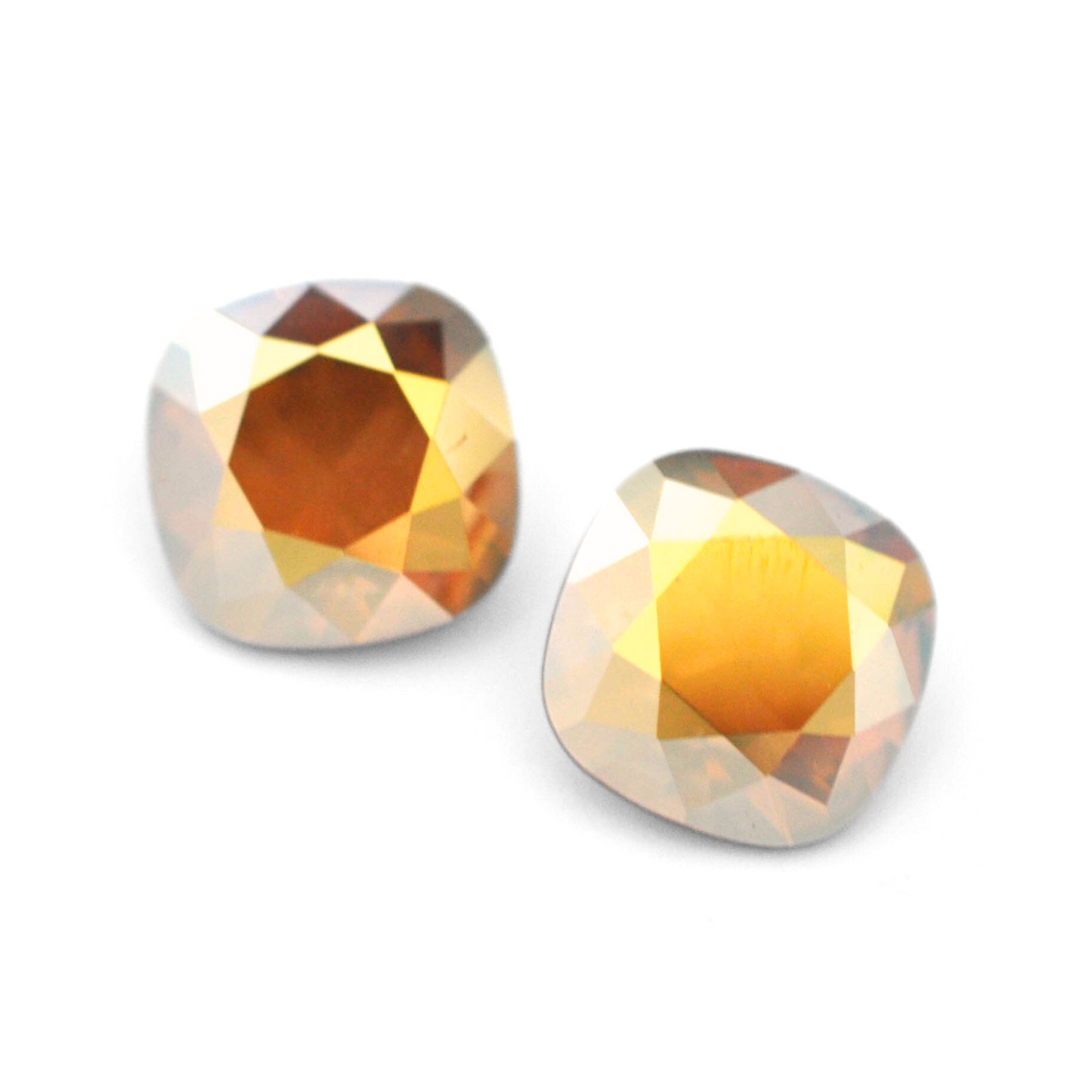 Cushion Square faceted Austrian crystal rhinestones in the color Metallic Sunshine displayed on a white background.