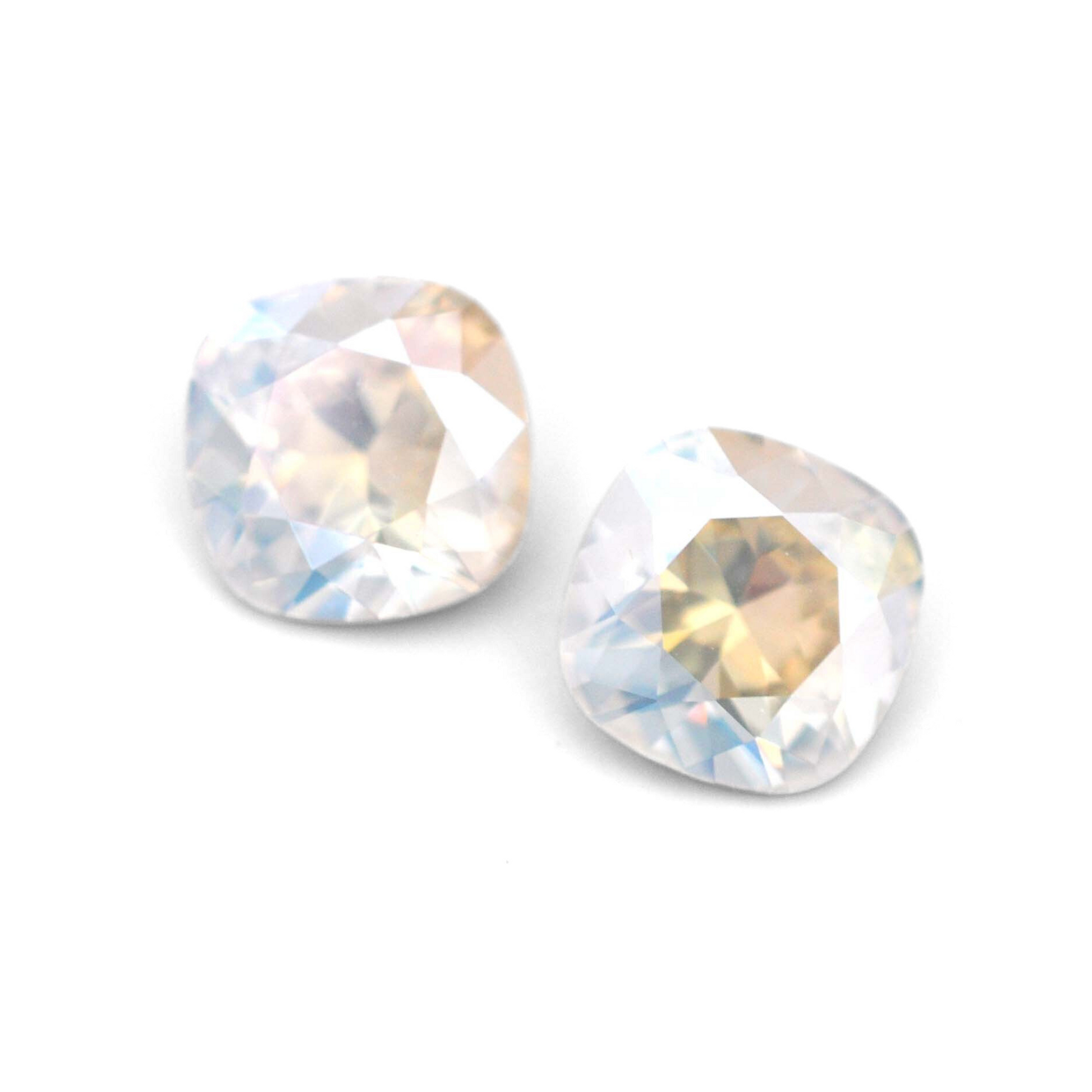 Cushion Square faceted Austrian crystal rhinestones in the color Moonlight displayed on a white background.