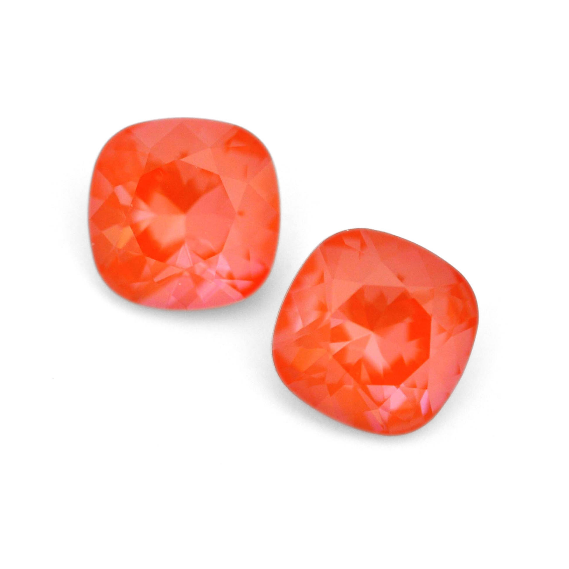 Cushion Square faceted Austrian crystal rhinestones in the color Orange Ignite displayed on a white background.