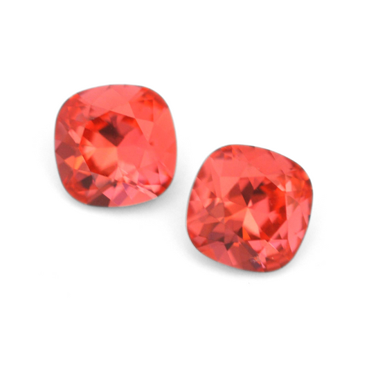 Cushion Square faceted Austrian crystal rhinestones in the color Padparadscha displayed on a white background.