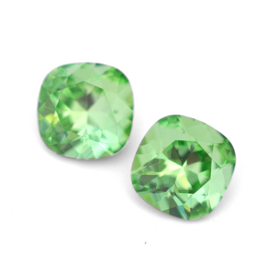 Cushion Square faceted Austrian crystal rhinestones in the color Peridot displayed on a white background.