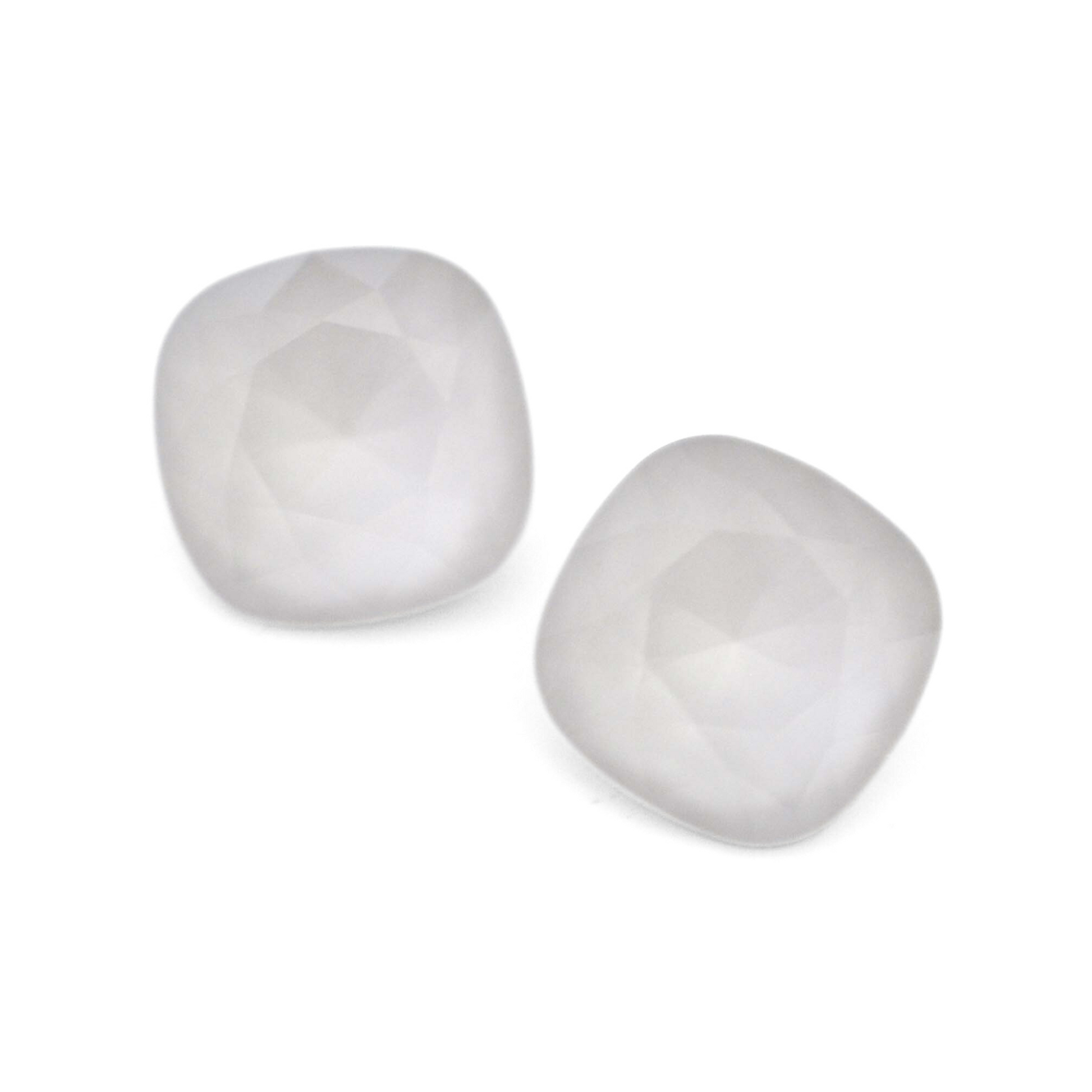 Cushion Square faceted Austrian crystal rhinestones in the color Powder Grey displayed on a white background.