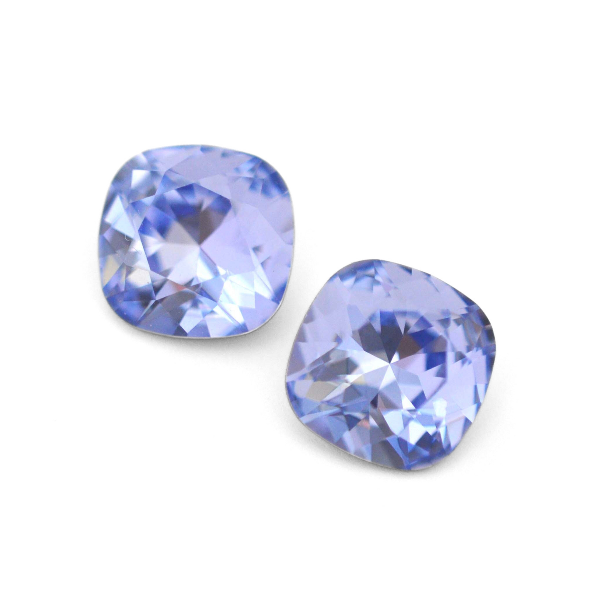 Cushion Square faceted Austrian crystal rhinestones in the color Provence Lavender displayed on a white background.