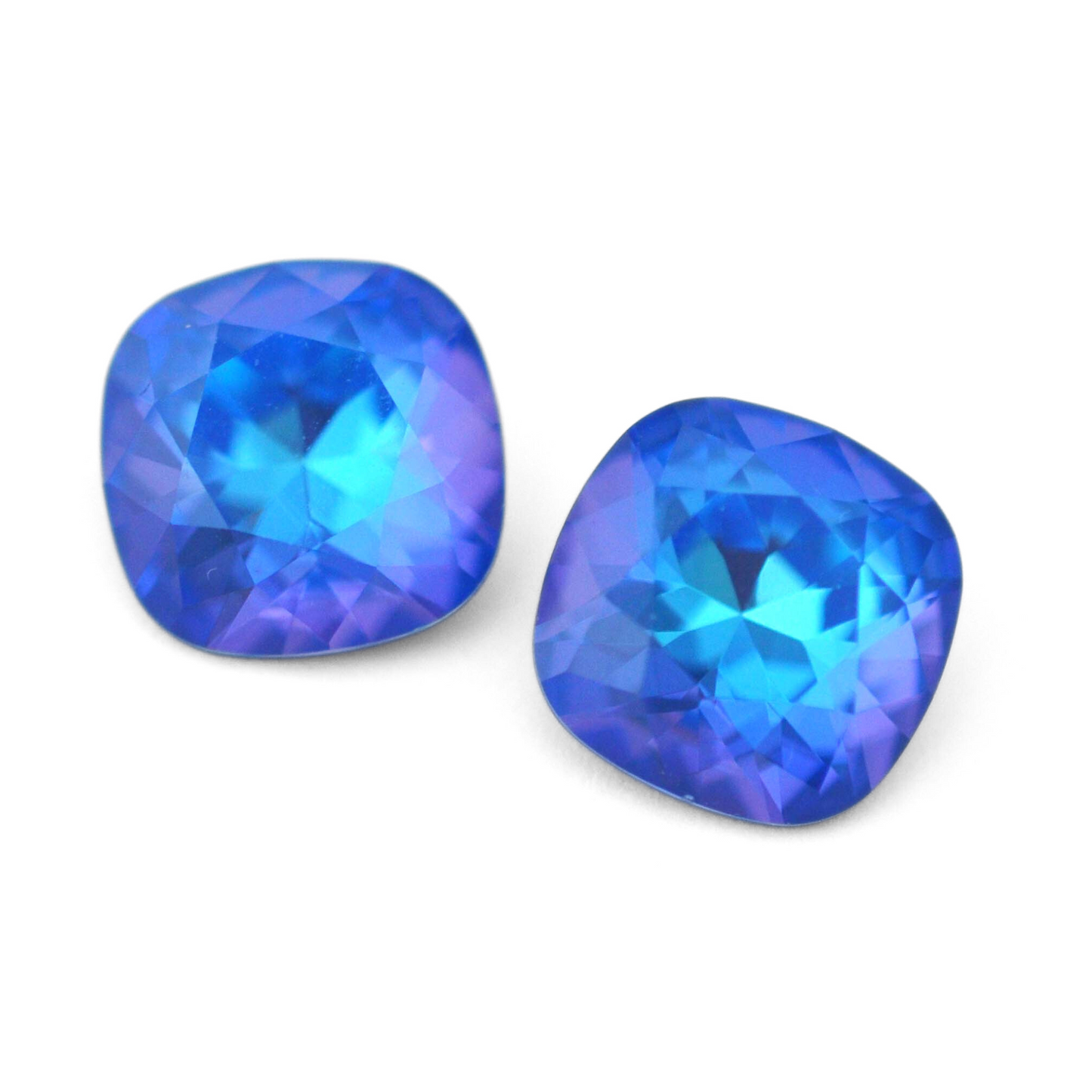 Cushion Square faceted Austrian crystal rhinestones in the color Royal Blue Delite displayed on a white background.