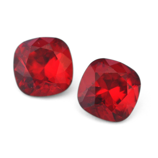 Cushion Square faceted Austrian crystal rhinestones in the color Siam displayed on a white background.