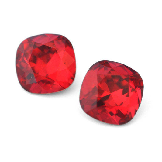 Cushion Square faceted Austrian crystal rhinestones in the color Scarlet displayed on a white background.