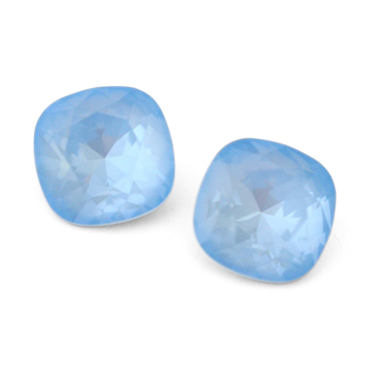 Cushion Square faceted Austrian crystal rhinestones in the color Sky Ignite displayed on a white background.