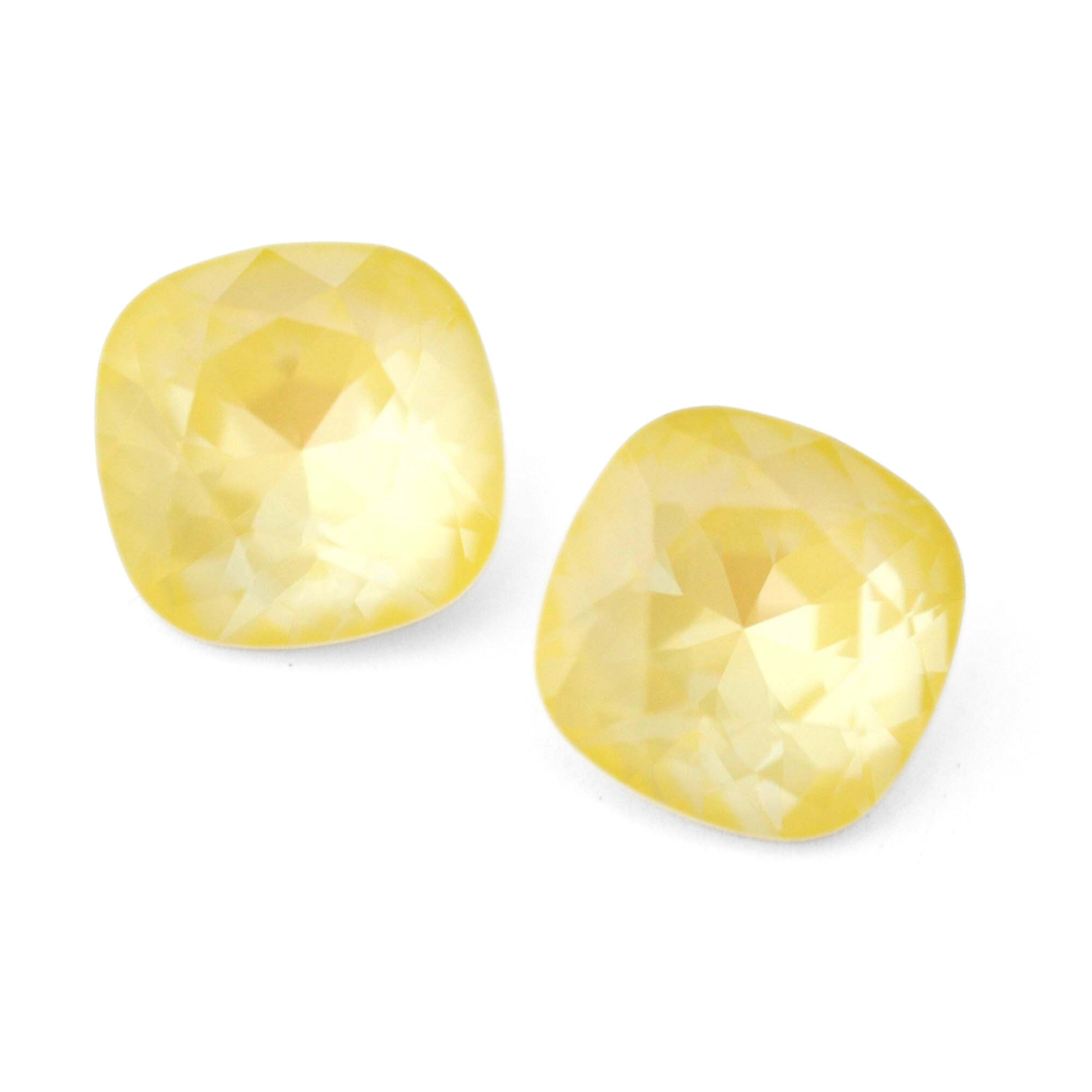 Cushion Square faceted Austrian crystal rhinestones in the color Soft Yellow Ignite displayed on a white background.