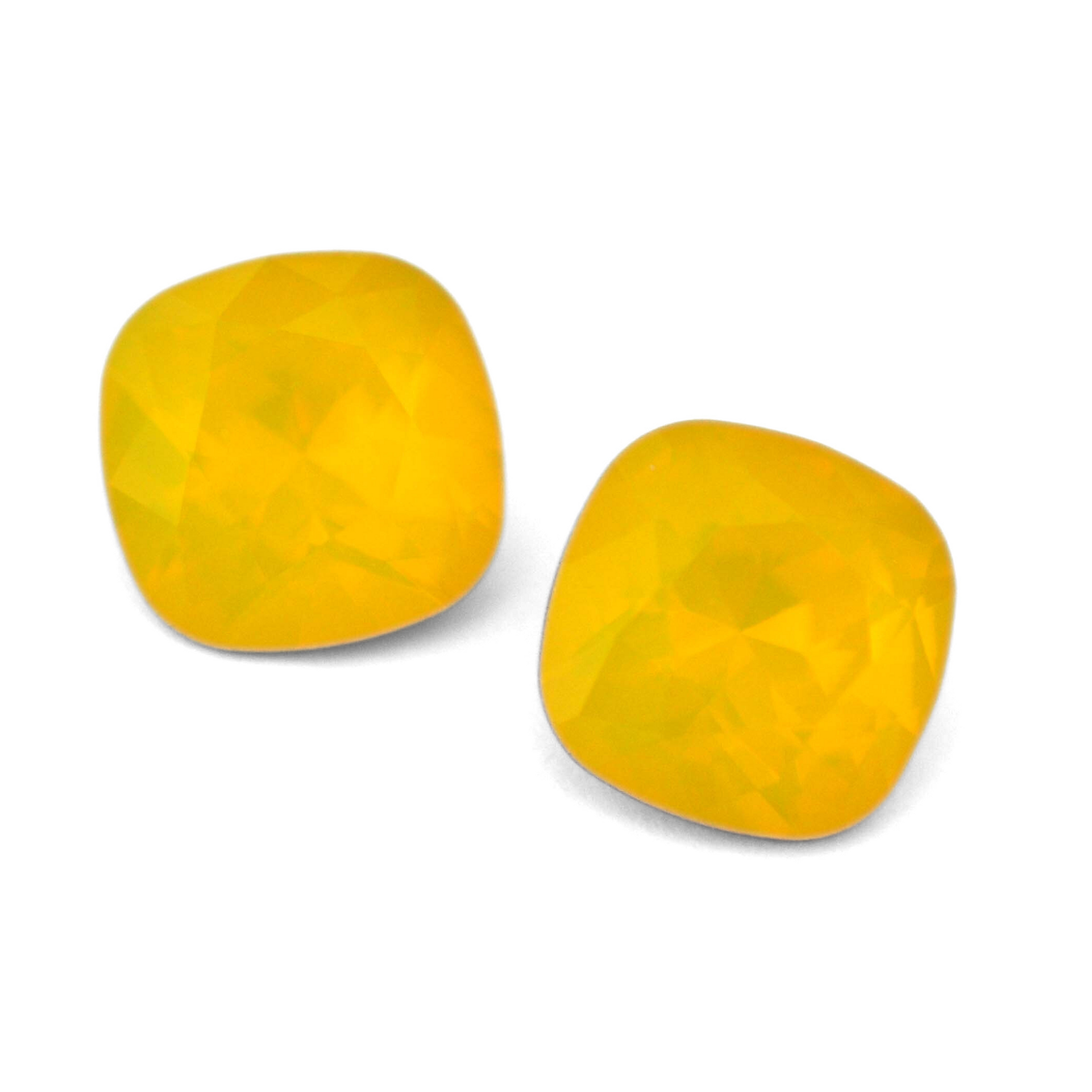 Cushion Square faceted Austrian crystal rhinestones in the color Yellow Opal displayed on a white background.