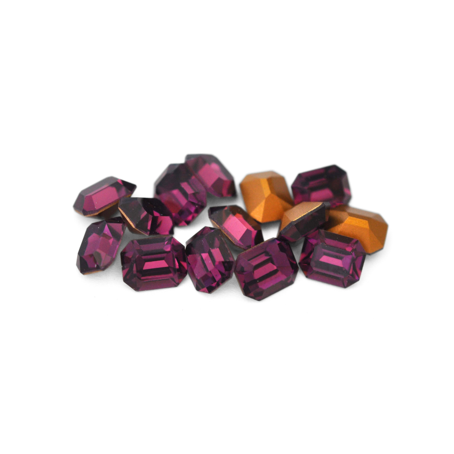 Octagon shaped faceted Austrian crystal rhinestones in the color Amethyst displayed on a white background.