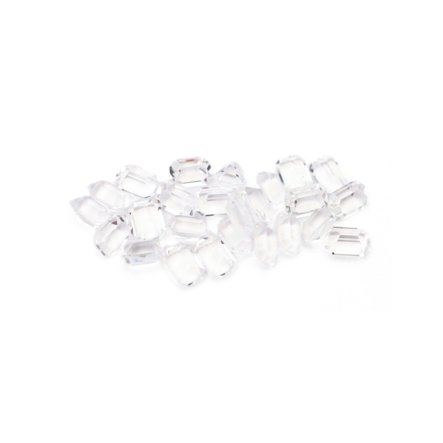 Octagon shaped faceted Austrian crystal rhinestones in the color Crystal displayed on a white background.