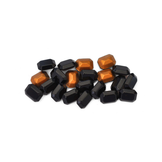 Octagon shaped faceted Austrian crystal rhinestones in the color Jet displayed on a white background.