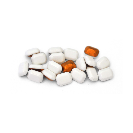 Octagon shaped faceted Austrian crystal rhinestones in the color Chalk White displayed on a white background.