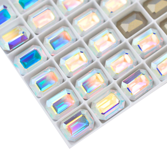 Octagon shaped faceted Austrian crystal rhinestones in the color Crystal AB displayed on a white background.