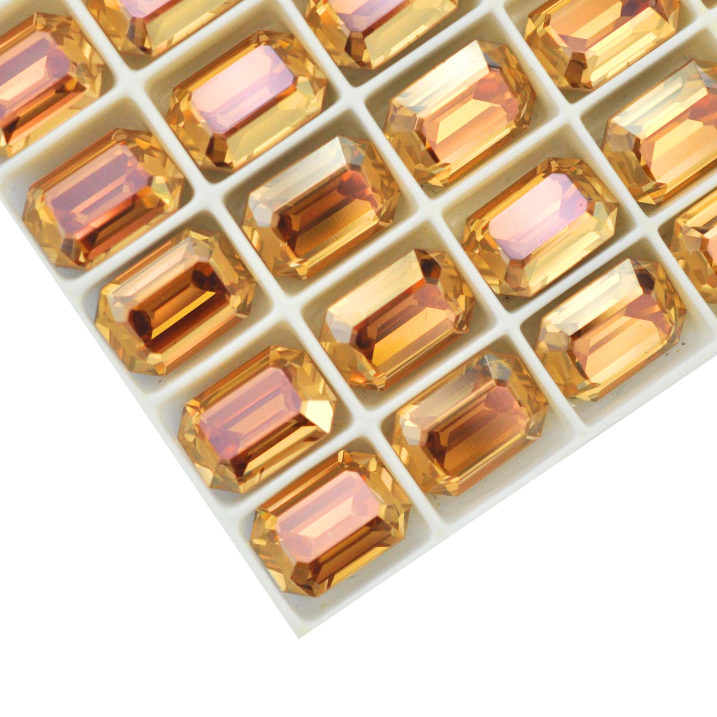 Octagon shaped faceted Austrian crystal rhinestones in the color Gold Shine displayed on a white background.