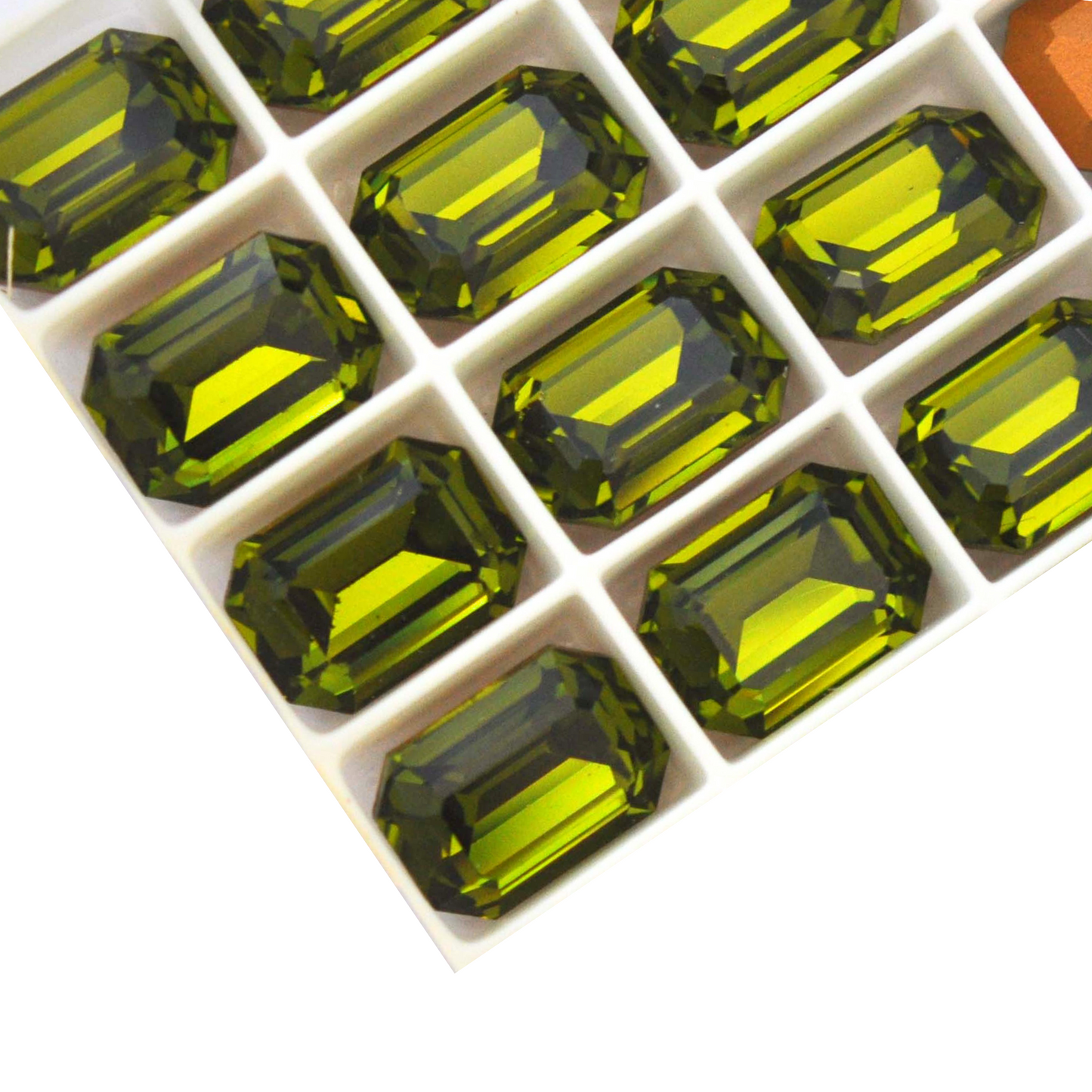 Octagon shaped faceted Austrian crystal rhinestones in the color Olivine displayed on a white background.