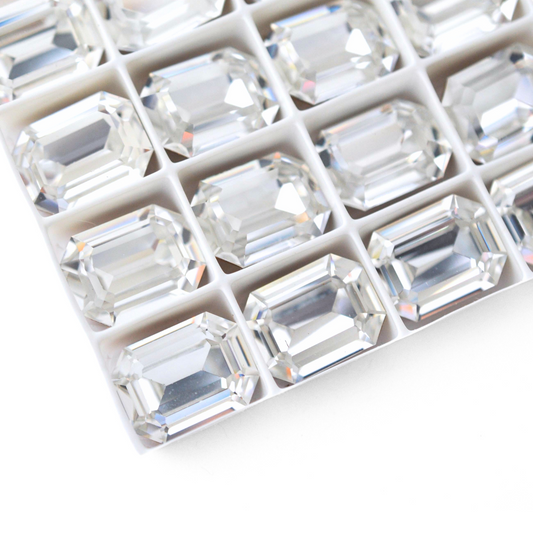 Octagon shaped faceted Austrian crystal rhinestones in the color Crystal displayed on a white background.