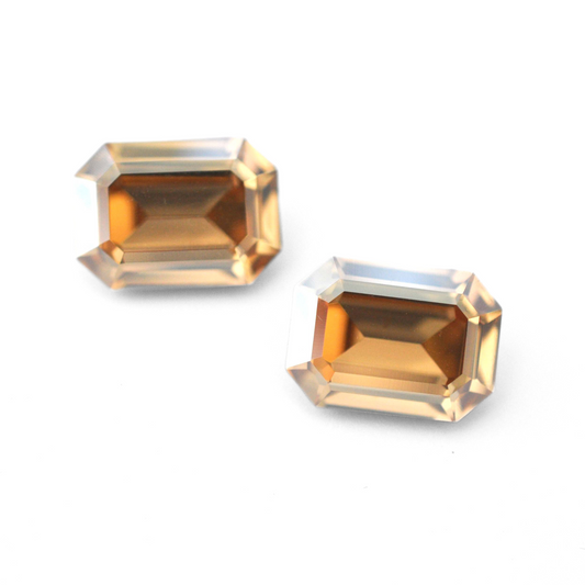 Octagon shaped faceted Austrian crystal rhinestones in the color Golden Shadow displayed on a white background.
