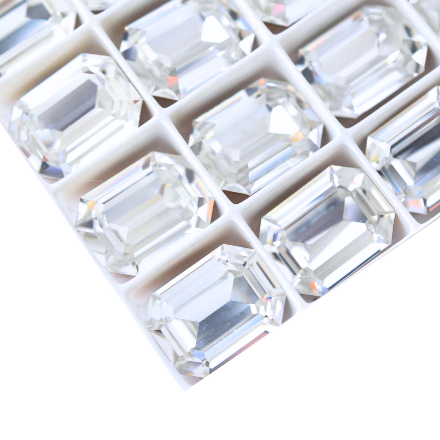 Octagon shaped faceted Austrian crystal rhinestones in the color Crystal displayed on a white background.