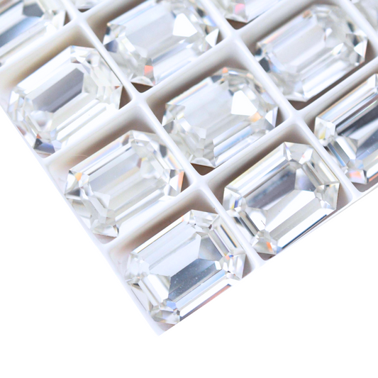 Octagon shaped faceted Austrian crystal rhinestones in the color Crystal displayed on a white background.