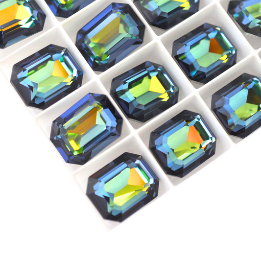 Octagon shaped faceted Austrian crystal rhinestones in the color Sahara displayed on a white background.