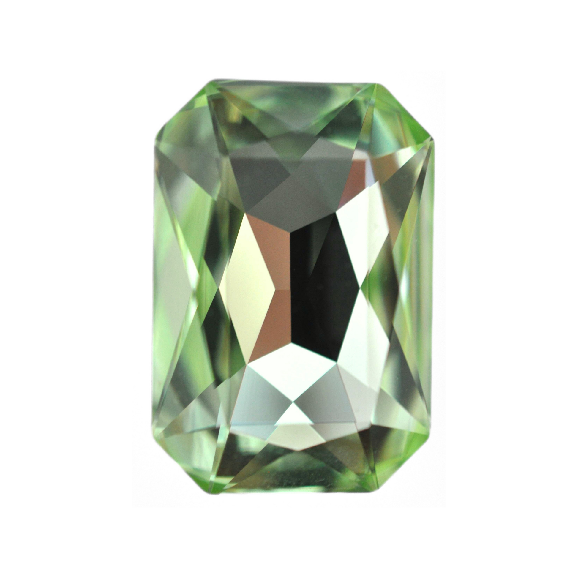 One large octagon shape faceted Austrian crystal rhinestones in the color Chrysolite displayed on a white background.