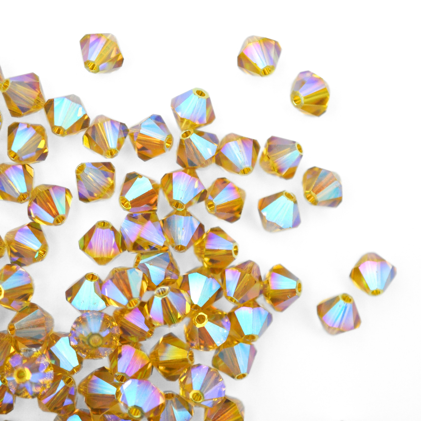 Austrian crystal 5328 bicone beads in the color Lime AB 2X spilling out onto a white background.