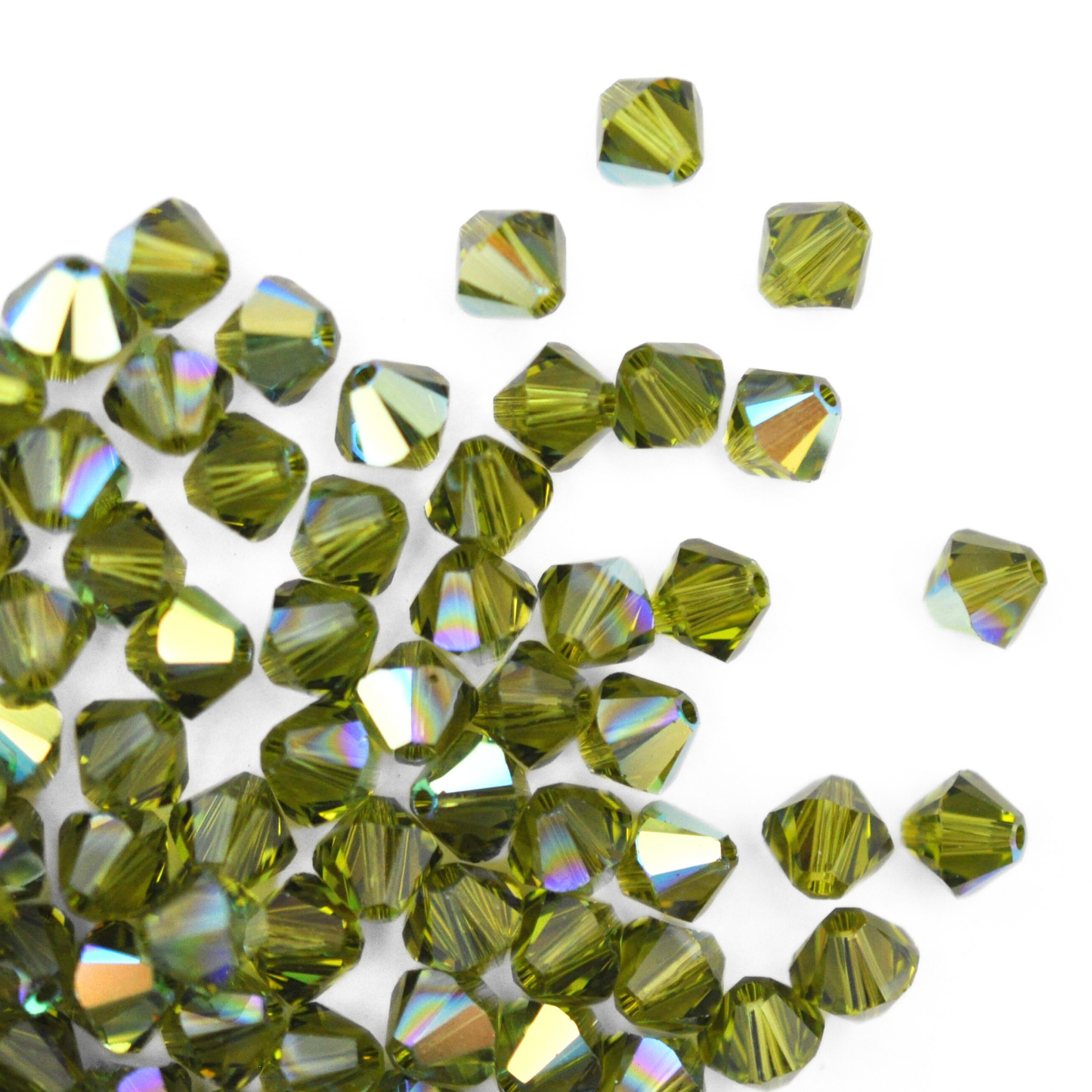 Austrian crystal 5328 bicone beads in the color Olivine AB spilling out onto a white background.