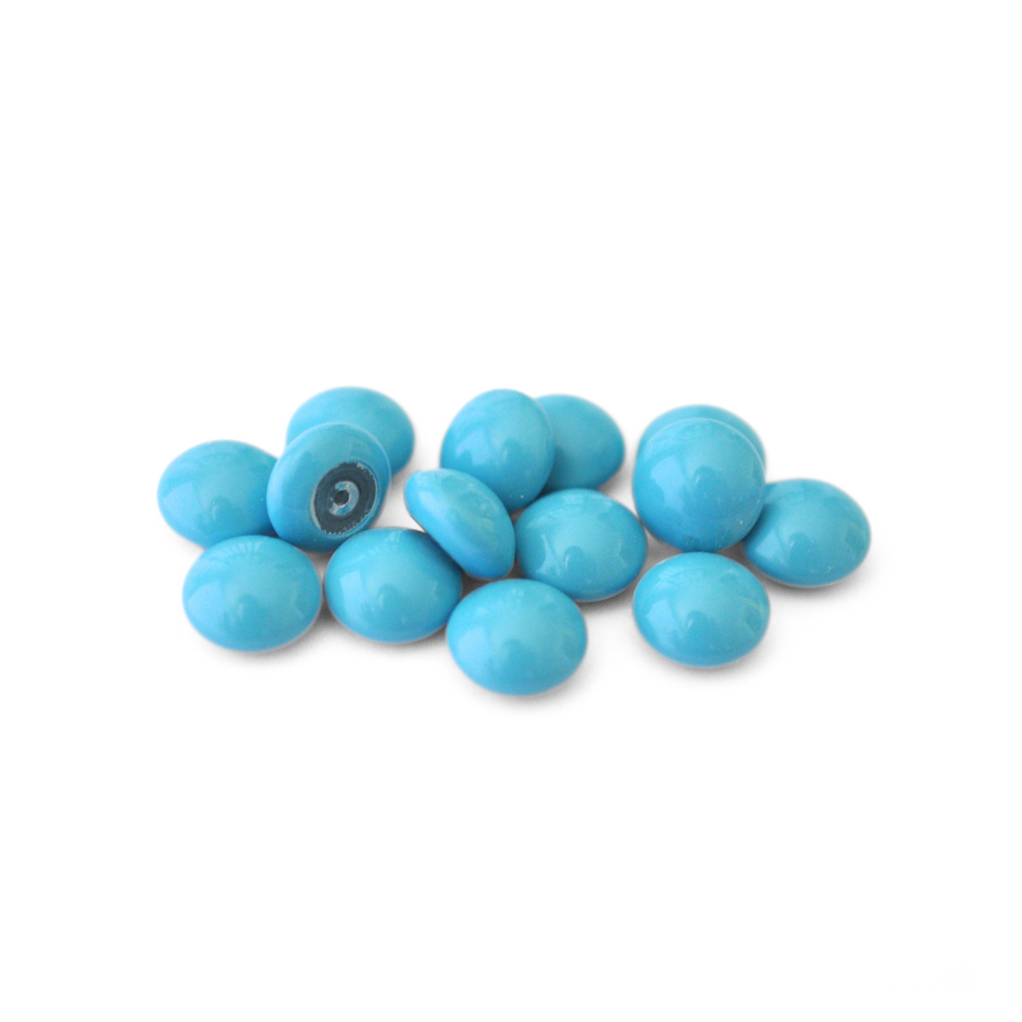 Round Austrian Crystal Glass Pearl Cabochons in the color Turquoise displayed on a white background
