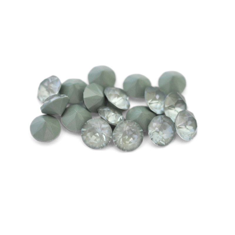 Round faceted Austrian crystal rhinestones in the color Agave Ignite displayed on a white background