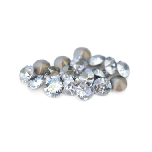 Round faceted Austrian crystal rhinestones in the color Blue Shade displayed on a white background