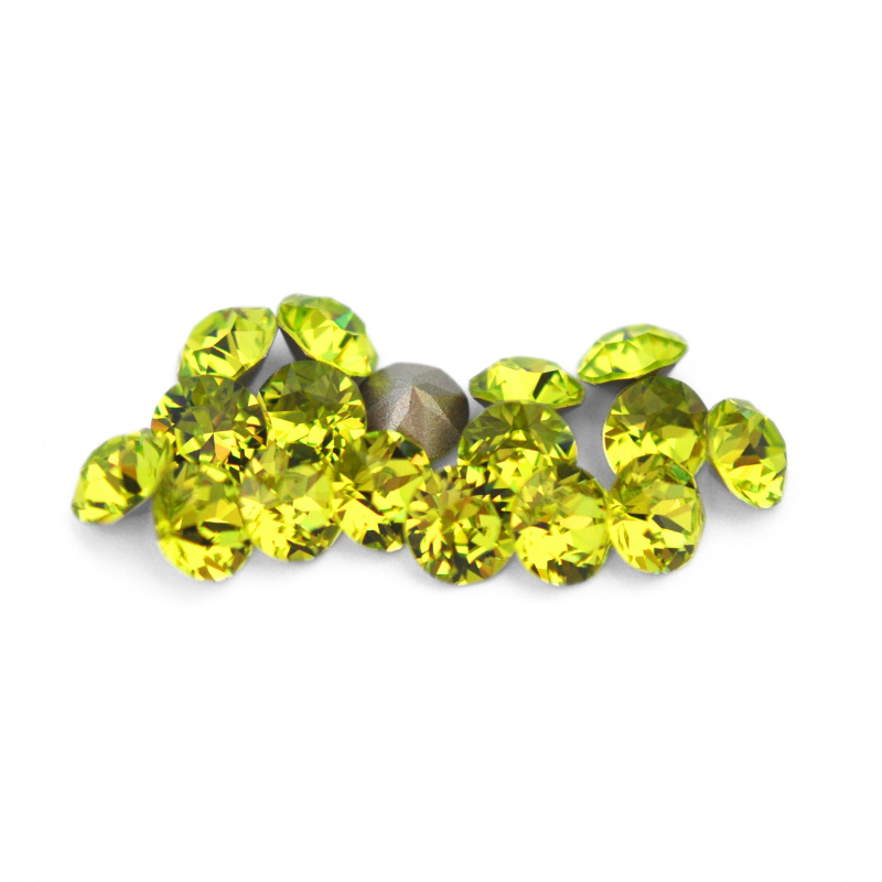 Round faceted Austrian crystal rhinestones in the color Citrus Green displayed on a white background