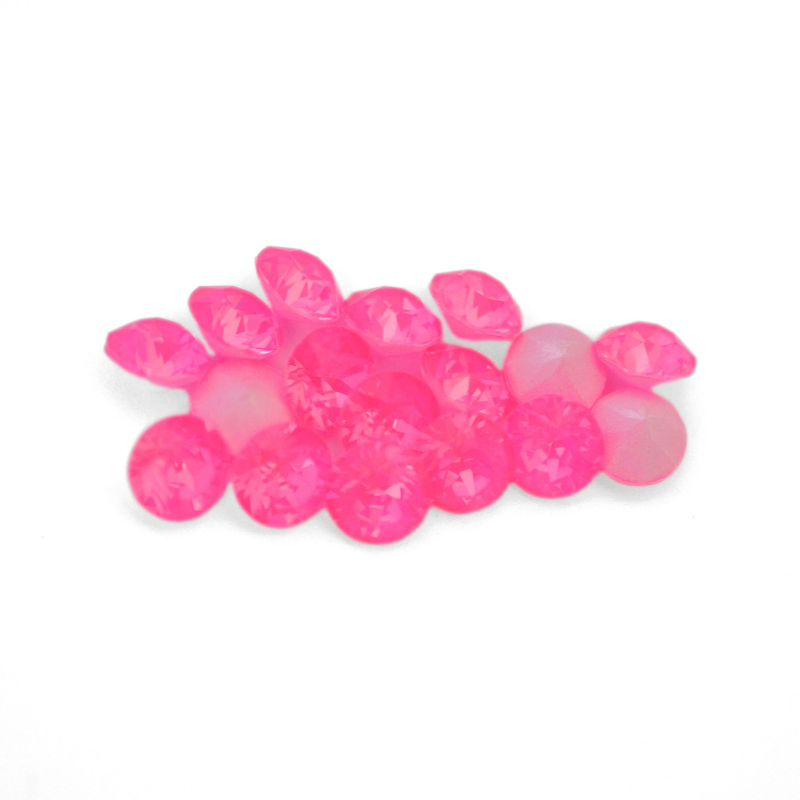 Round faceted Austrian crystal rhinestones in the color Electric Pink Ignite displayed on a white background