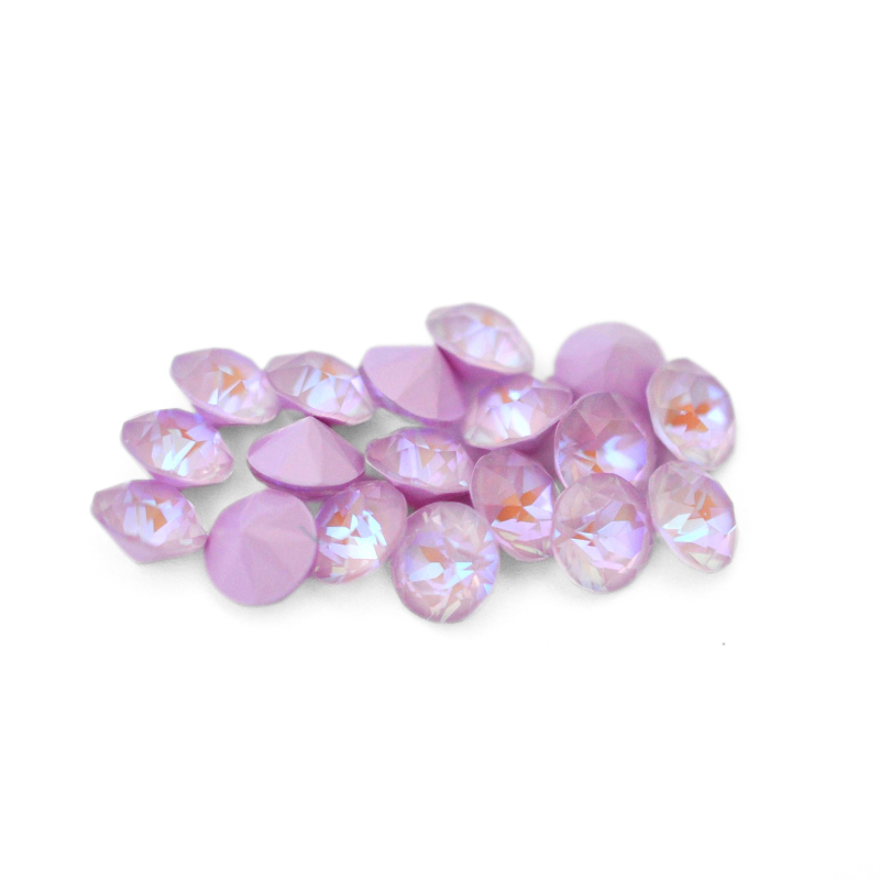 Round faceted Austrian crystal rhinestones in the color Lavender Delite displayed on a white background