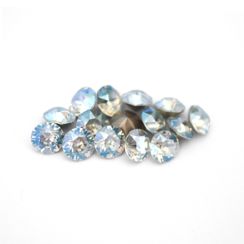 Round faceted Austrian crystal rhinestones in the color Light Azore Moonlight displayed on a white background