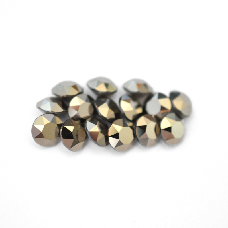 Round faceted Austrian crystal rhinestones in the color Metallic Light Gold displayed on a white background