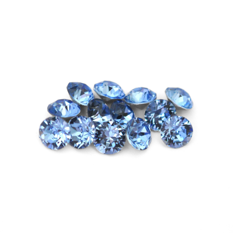 Round faceted Austrian crystal rhinestones in the color Light Sapphire displayed on a white background
