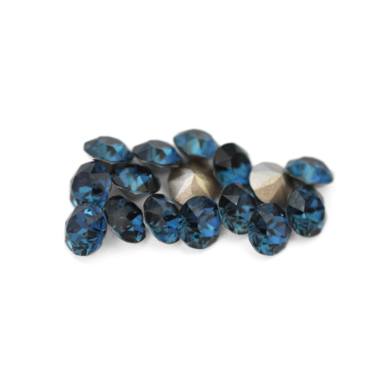 Round faceted Austrian crystal rhinestones in the color Montana displayed on a white background