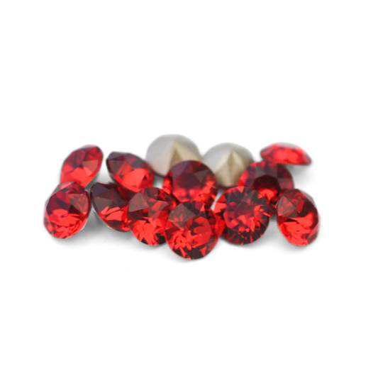 Round faceted Austrian crystal rhinestones in the color Scarlet displayed on a white background