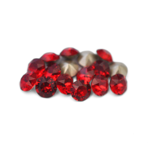 Round faceted Austrian crystal rhinestones in the color Siam displayed on a white background