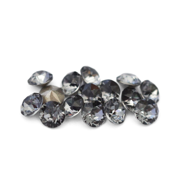 Round faceted Austrian crystal rhinestones in the color Silver Night displayed on a white background