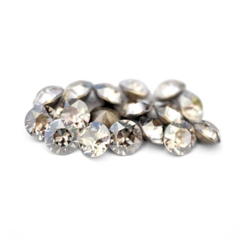 Round faceted Austrian crystal rhinestones in the color Silver Shade displayed on a white background