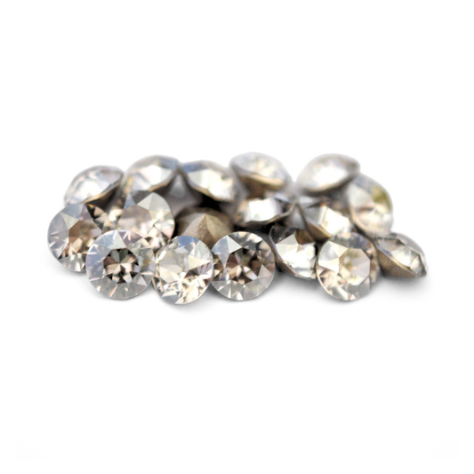 Round faceted Austrian crystal rhinestones in the color Silver Shade displayed on a white background