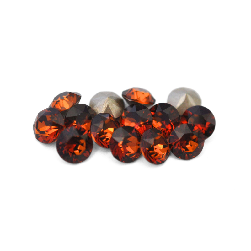 Round faceted Austrian crystal rhinestones in the color Smoked Amber displayed on a white background