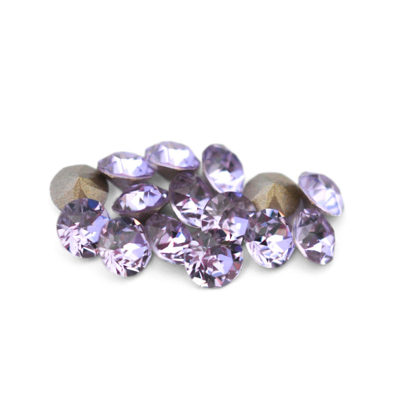 Round faceted Austrian crystal rhinestones in the color Violet displayed on a white background