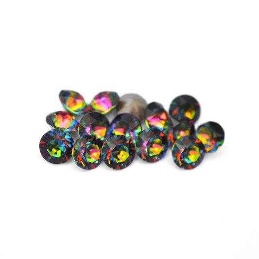Round faceted Austrian crystal rhinestones in the color Vitrail Medium displayed on a white background
