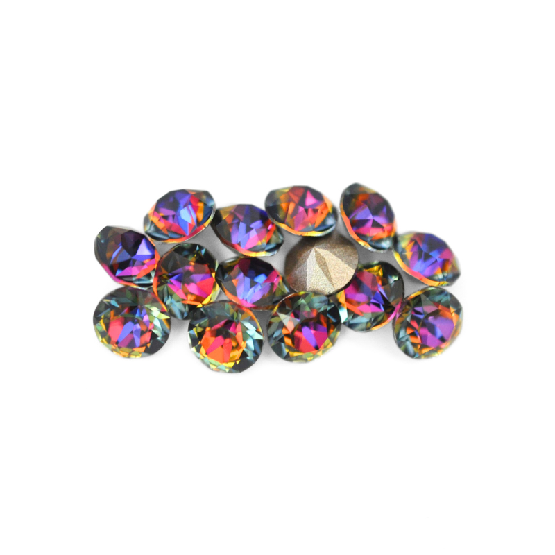 Round faceted Austrian crystal rhinestones in the color Volcano displayed on a white background