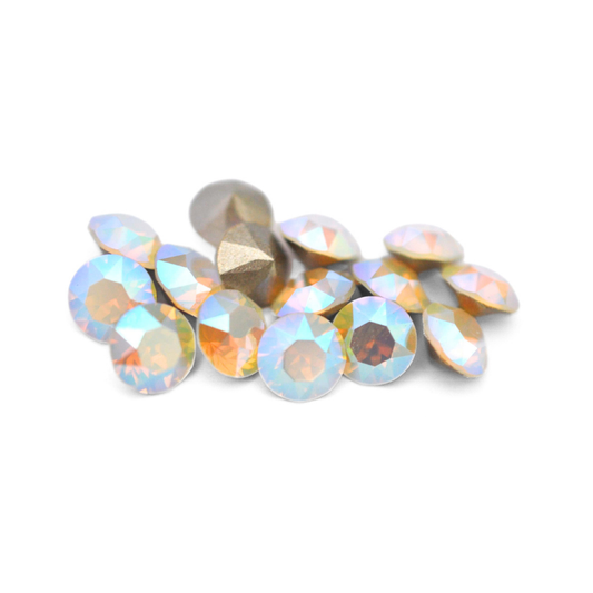 Round faceted Austrian crystal rhinestones in the color White Opal Shimmer displayed on a white background