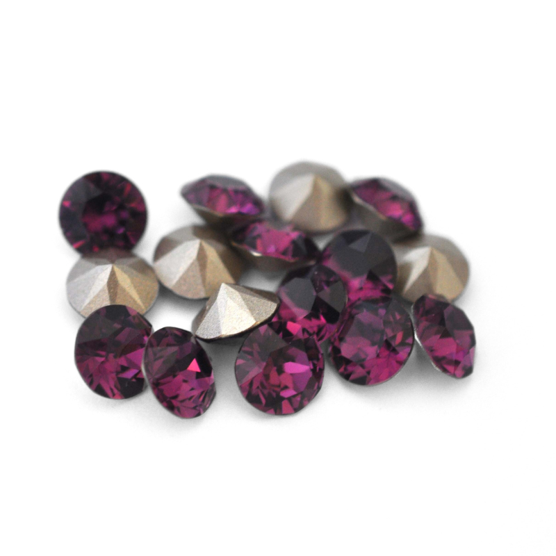 Round faceted Austrian crystal rhinestones in the color Amethyst displayed on a white background.