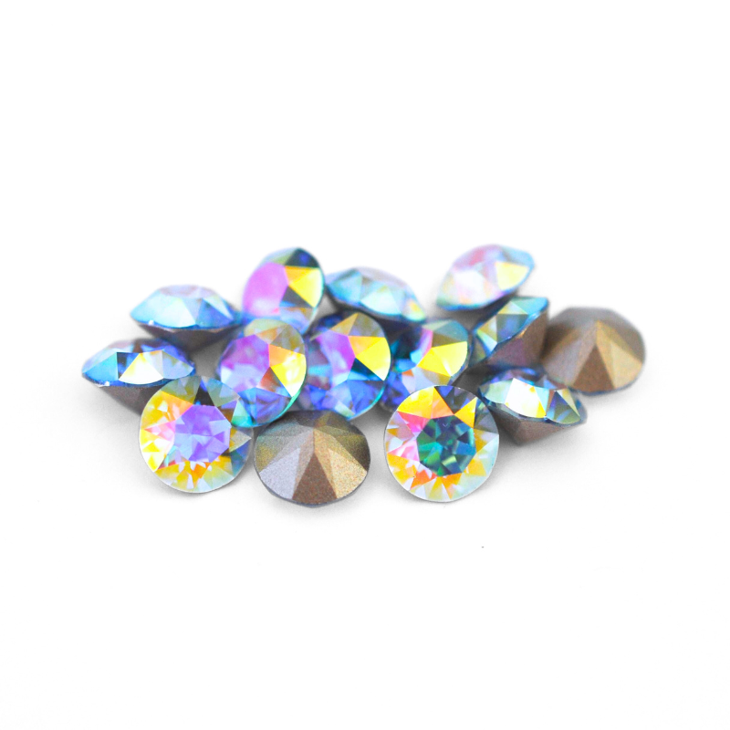 Round faceted Austrian crystal rhinestones in the color Aqua Transmission displayed on a white background.